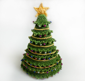 http://www.crochetspot.com/crochet-pattern-christmas-tree-hat-5-sizes/