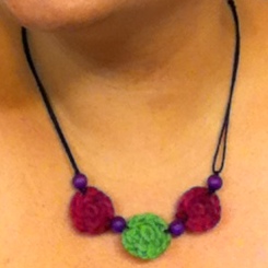 Make a necklace with three crocheted beads and coordinating wooden beads.