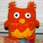 Carole's lovable owl is orange and yellow.