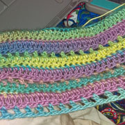 This colorful scarf is finished by Carol.