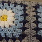 Cynthia is working on a granny square afghan.