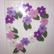 Reana crocheted and framed these flowers.