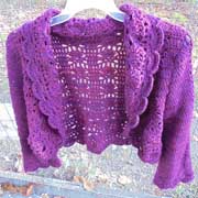 Daelynn finished this purple sweater with a scallop border.
