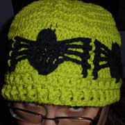 Daelynn crocheted this hat with spider appliques.