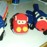 Linda crocheted a toy truck, car and airplane.