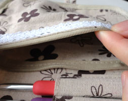 This zippered pocket is great for all of your small crochet notions.
