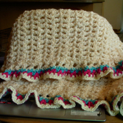 Sandy crocheted this free style baby blanket.