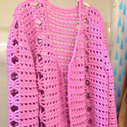 Molly finished this pink cardigan sweater.