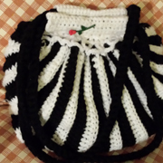 Mary crocheted this black and white striped handbag.