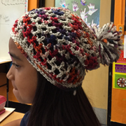 Mali crocheted this multi colored hat with pom pom.