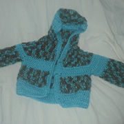 Susanne completed the 5 month old sized cardigan.