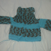 Susanne is working on a 5 month old sized cardigan.