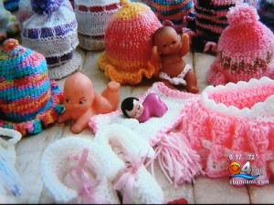 Although the newscasters referred to her work as "knitting," we can plainly see that most of it is crochet!