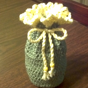 Emma crocheted a drawstring pouch.