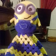 Kaz finished crocheting a minion lovey.
