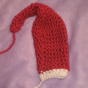 Susanne is working on a preemie sized Santa hat.