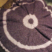 Mary finished crocheting this round afghan.