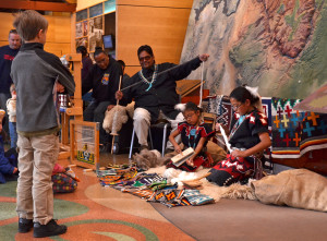 Chasingwind Cultural Consulting demonstrates the traditional Navajo way of carding and spinning wool during Grand Canyon National Park's Archaeology Day. NPS photo by Michael Quinn .
